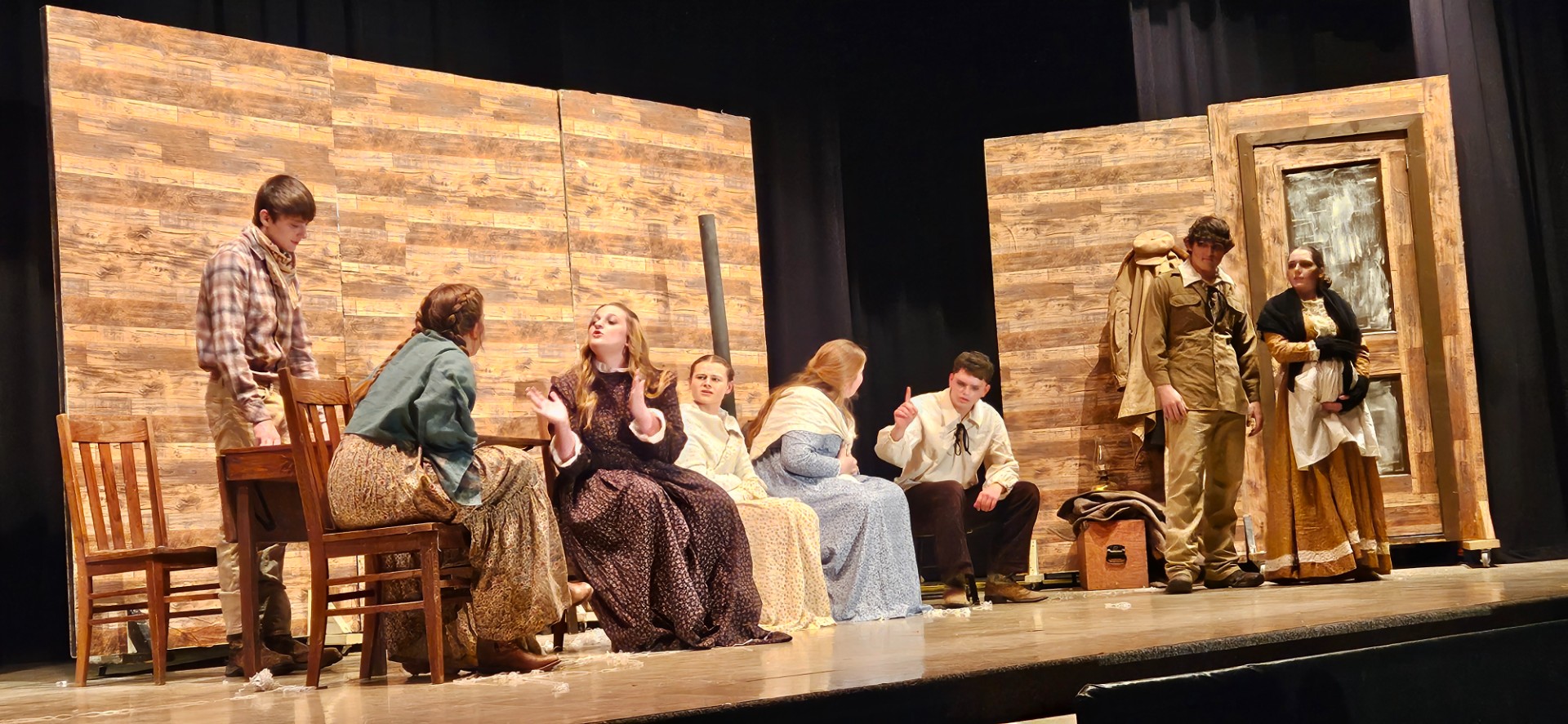 whole cast acting on stage